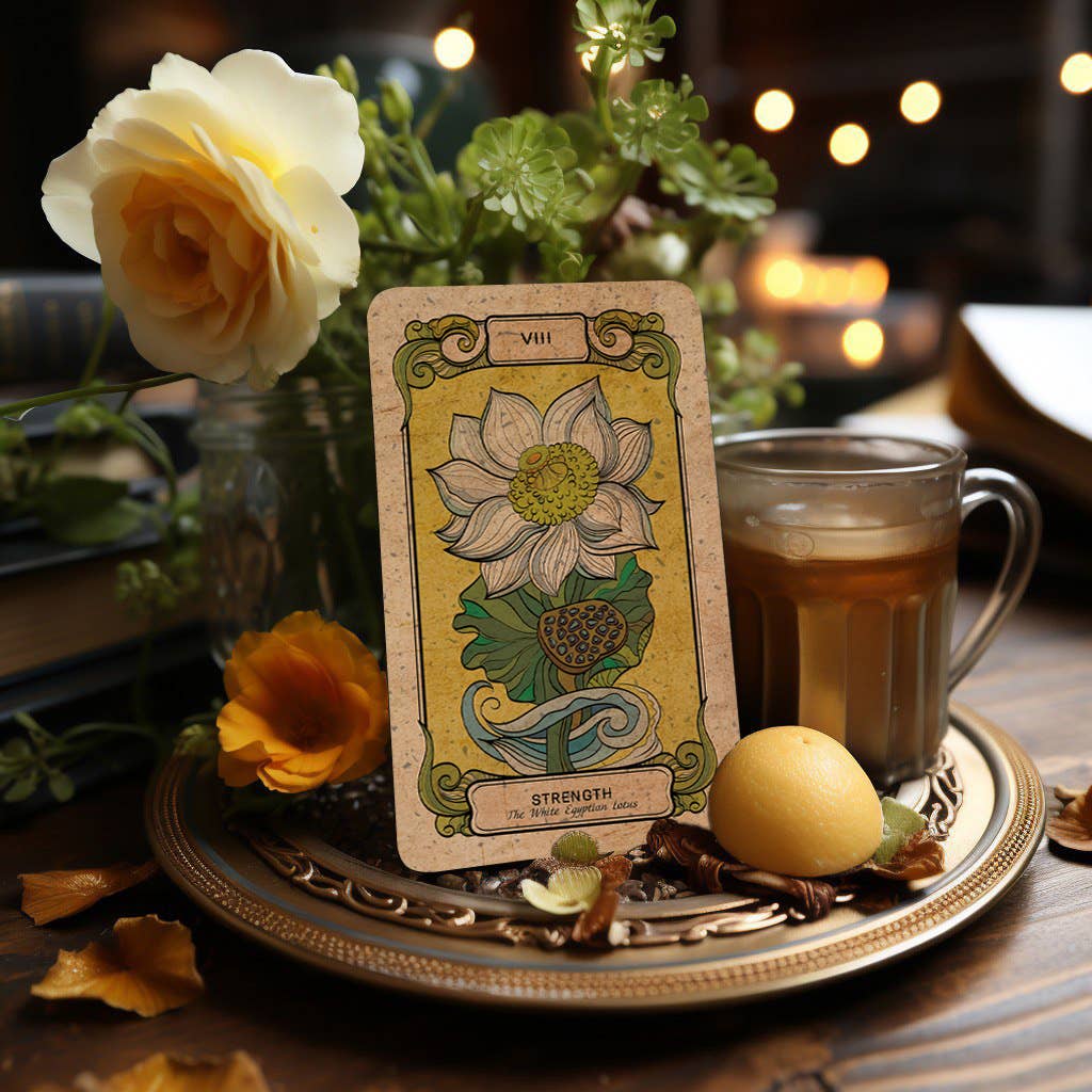 Dark Synevyr Botanica Oculta Tarot Deck 80 Cards - card "Strength" featuring a white lotus illustration on a wooden ritual tray with tea