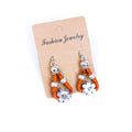 Meninas Bonitas Cork Flower Accessories Handmade Earrings 4x1.5cm – detail – orange cork drop earrings with silver-tone flower pendant and decorative beads.