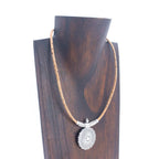 Meninas Bonitas Cork Handmade Cork Necklace 42cm – lifestyle – necklace displayed on a wooden jewellery bust.