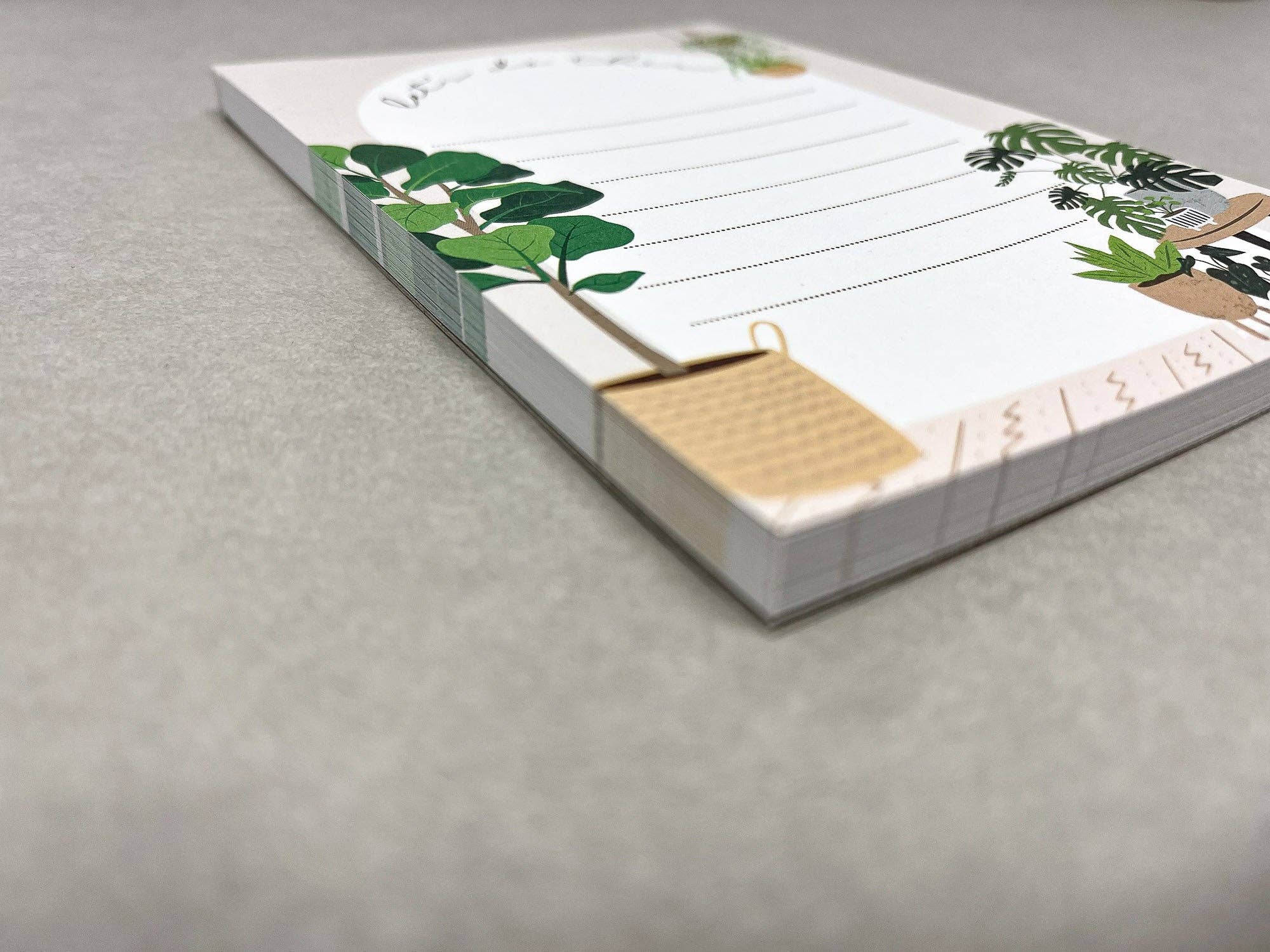 Side view of Home notepad showing stack thickness