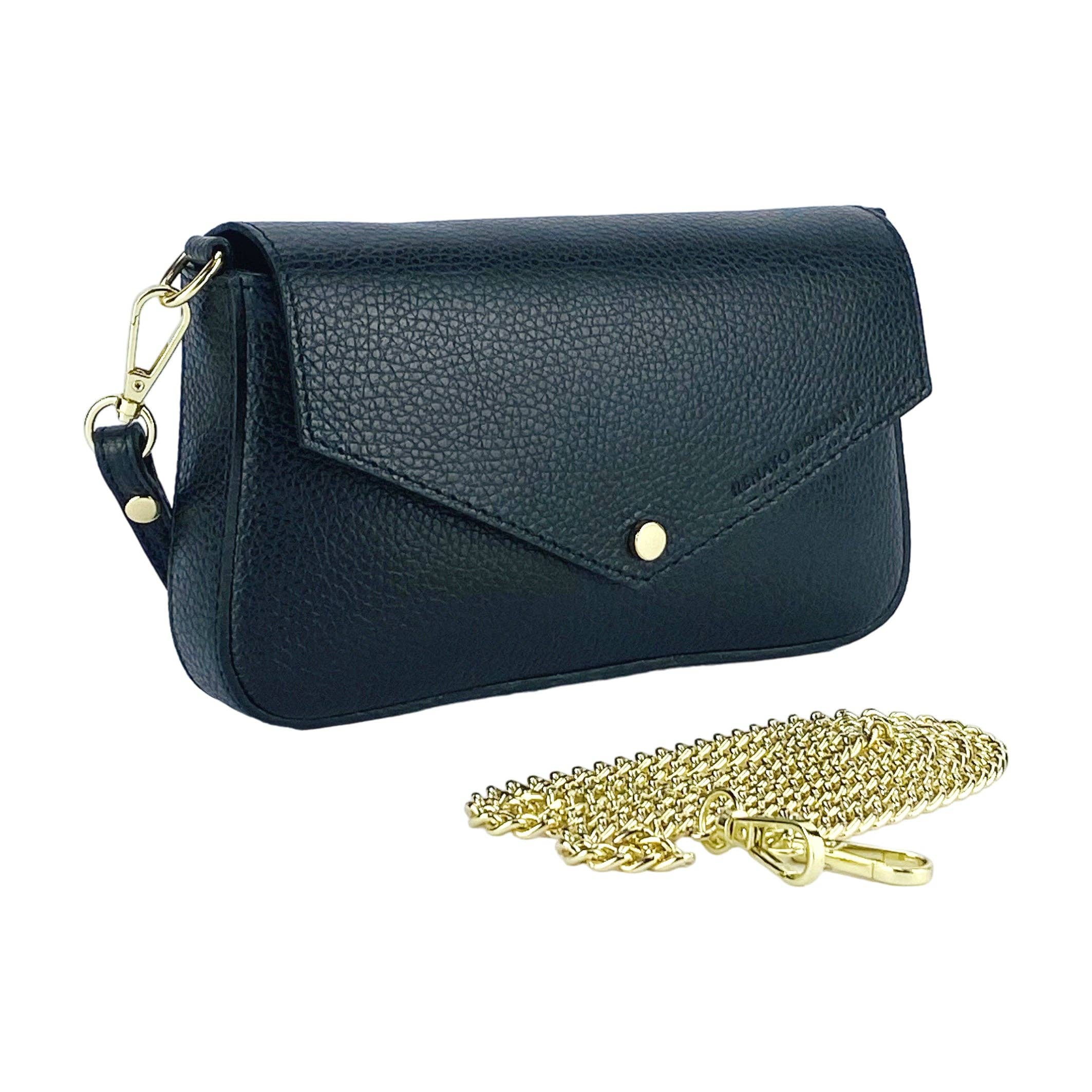 Black leather shoulder bag standing next to a detached gold chain strap