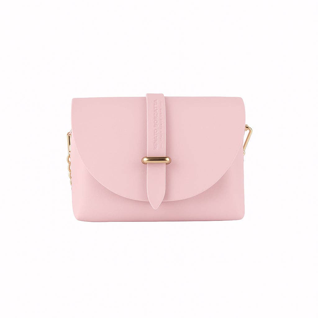 Front view of pink leather mini bag with flap and vertical strap closure